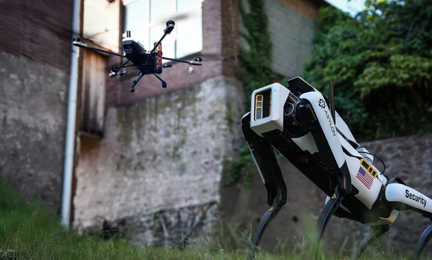Asylon DroneDog quadruped security robot and Guardian aerial drone operating together as integrated security system