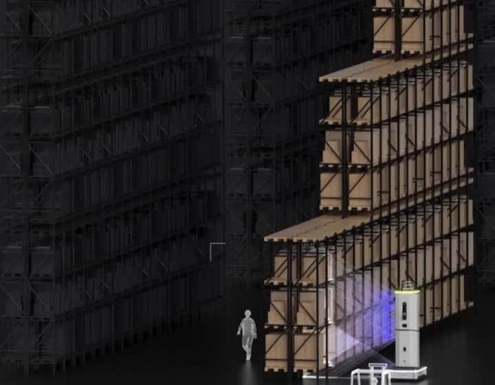 Dexory robot scanning a wide warehouse aisle