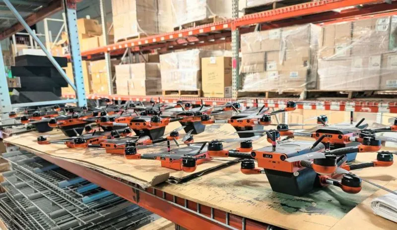 Fleet of autonomous drones performing warehouse inventory automation