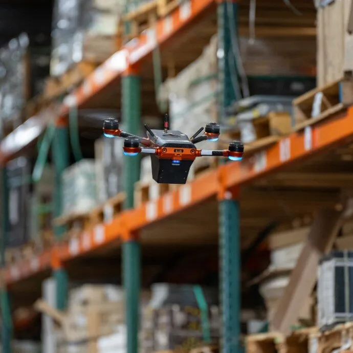 Corvus One drone in flight over warehouse pallet positions