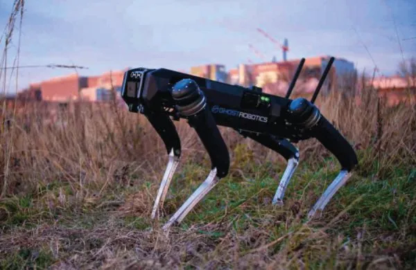 Ghost Robotics Vision 60 quadruped patrolling an industrial perimeter in wet weather
