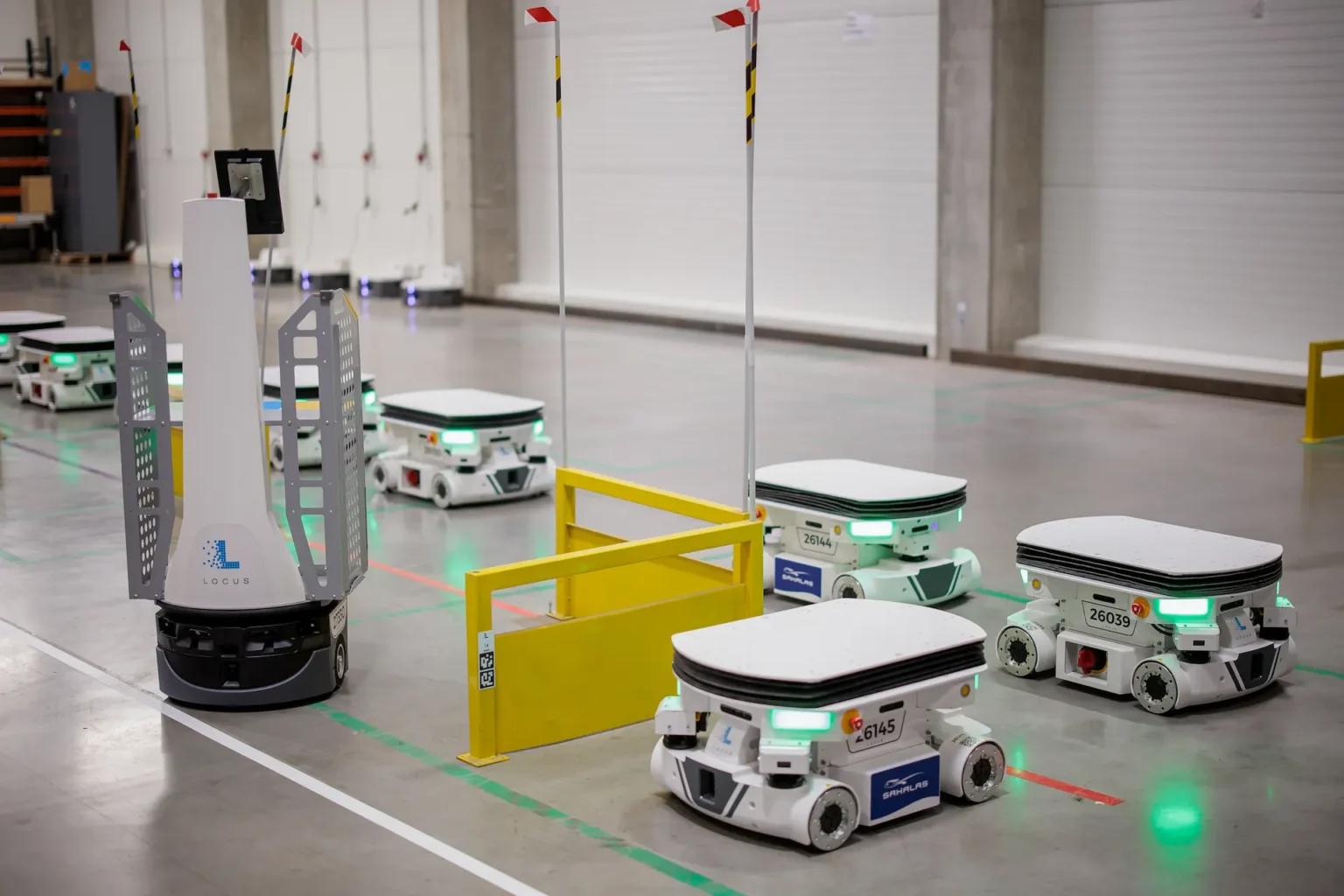 A Locus autonomous mobile robot waiting at a pick location in a customer warehouse