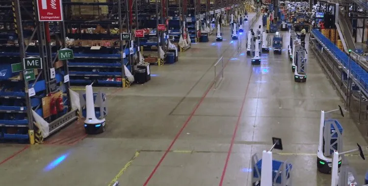 Automated warehouse systems with mobile robots and inventory drones